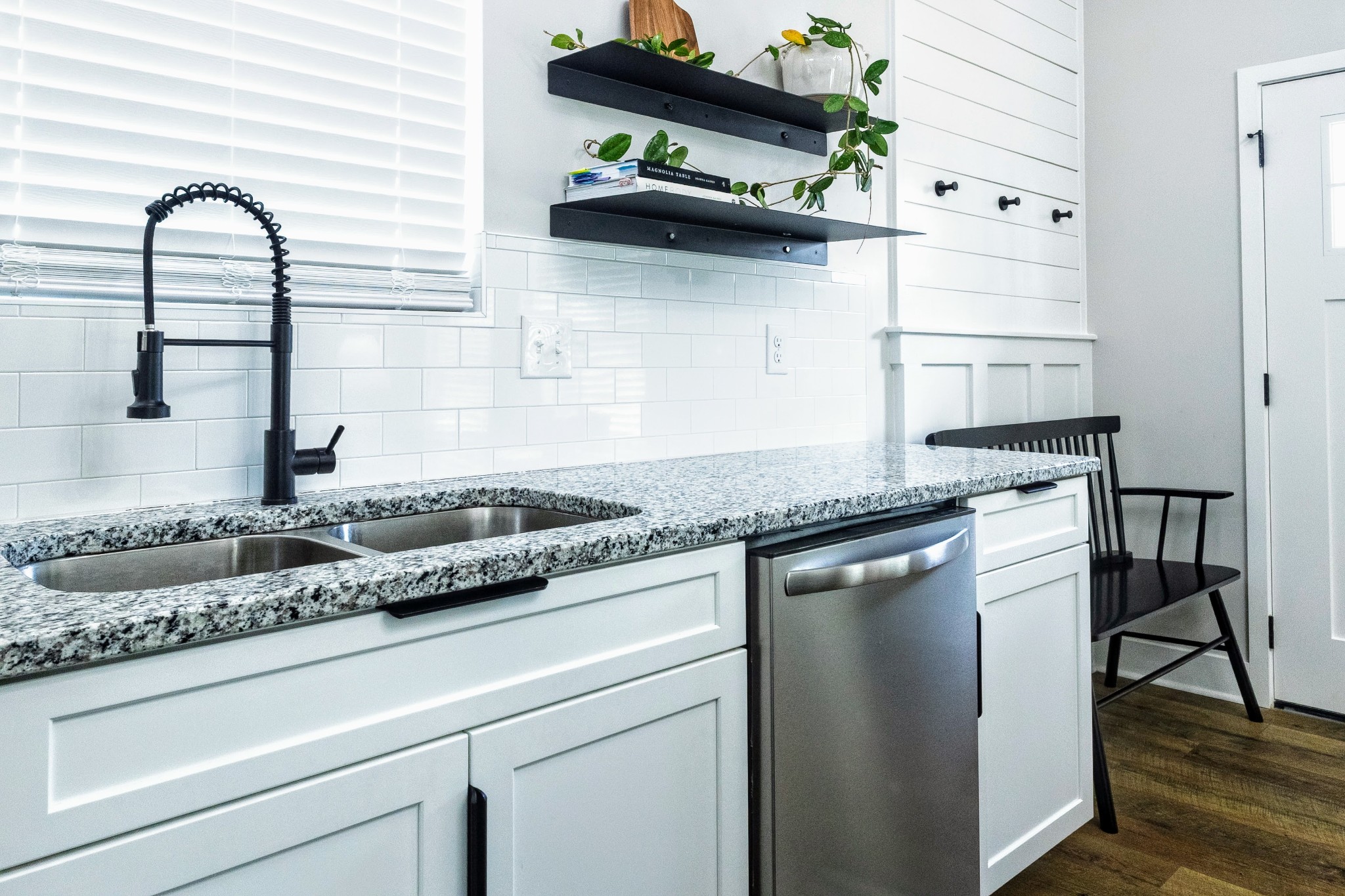 112 Wells Street Centerville, TN 37033 - Photo 8 of 22 a kitchen with granite countertop stainless steel appliances and white cabinets