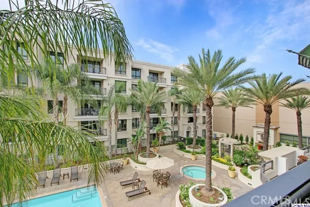 a view of balcony with potted plants and palm trees