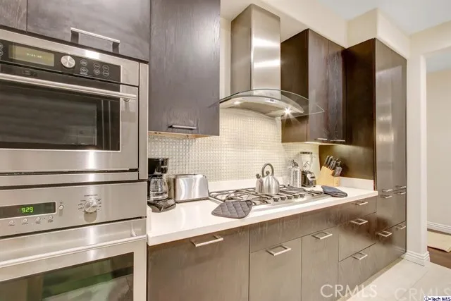 a kitchen with appliances and cabinets