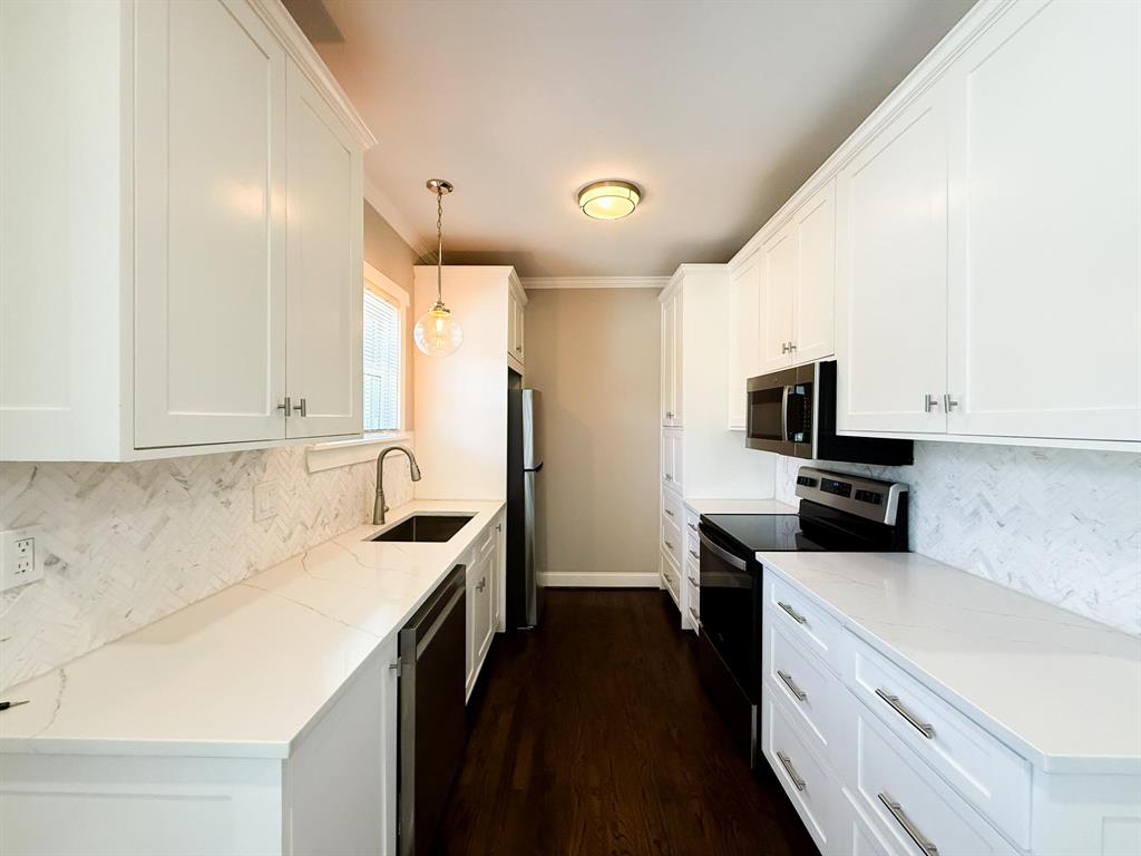 4114 Junius Street, Unit B Dallas, TX 75246 - Photo 11 of 23 a kitchen with a sink a stove and refrigerator