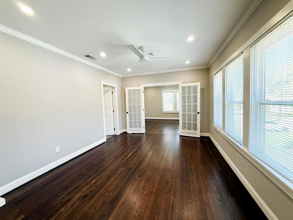 4114 Junius Street, Unit B Dallas, TX 75246 - Photo 14 of 23 wooden floor in an empty room with a window