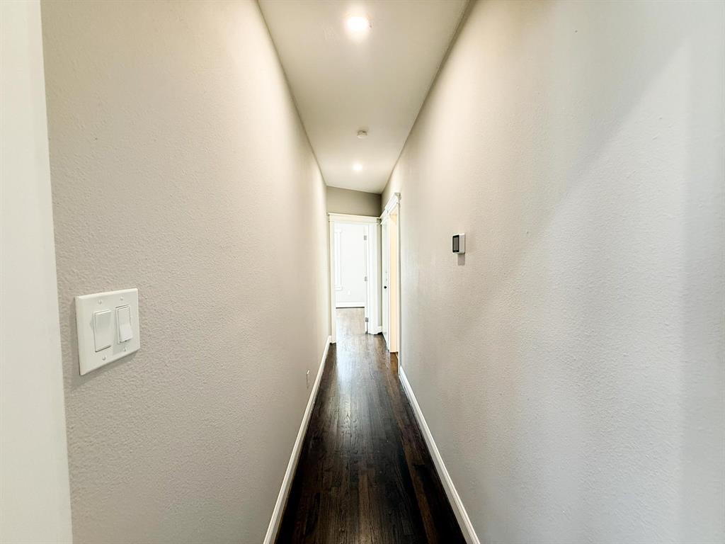 4114 Junius Street, Unit B Dallas, TX 75246 - Photo 15 of 23 a view of a hallway with wooden floor