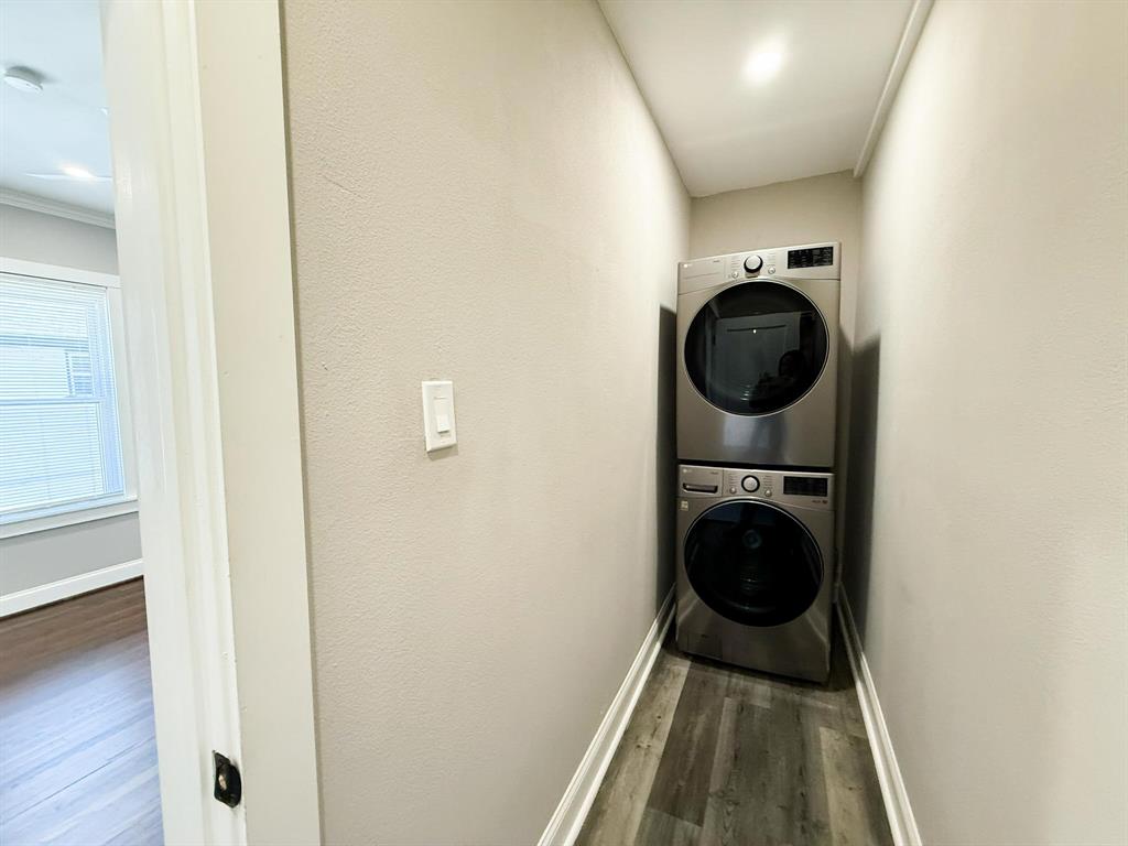 4114 Junius Street, Unit B Dallas, TX 75246 - Photo 22 of 23 a view of a hallway with washer and dryer