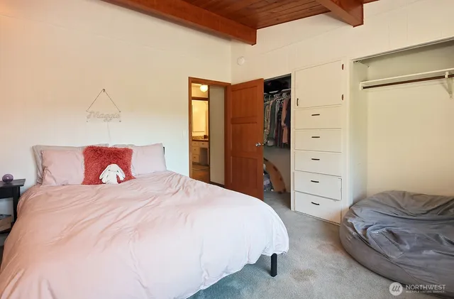 a bedroom with a bed and closet