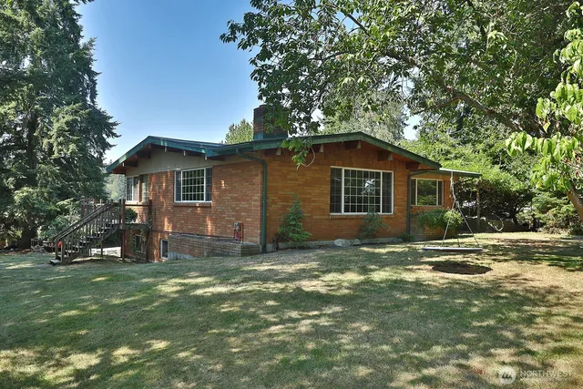 a view of a patio with table and chairs and potted plants