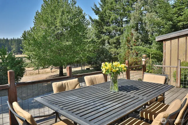 a view of a chairs and table in the outdoor