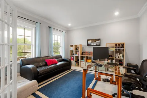 a living room with furniture workspace and a window
