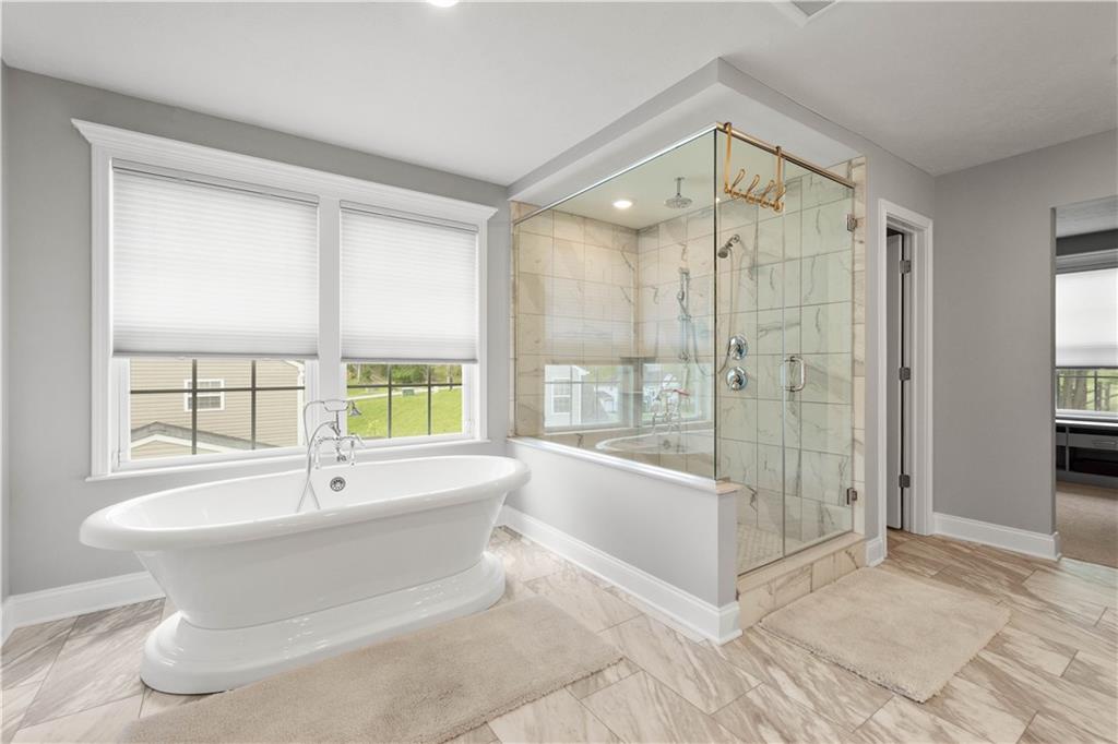 1197 Brook View Court Pittsburgh, PA 15237 - Photo 15 of 30 a spacious bathroom with a tub shower and windows