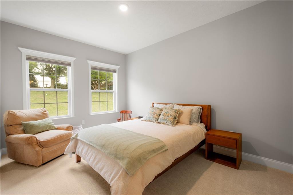 1197 Brook View Court Pittsburgh, PA 15237 - Photo 23 of 30 a bedroom with a bed and a couch