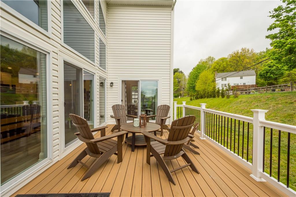 1197 Brook View Court Pittsburgh, PA 15237 - Photo 26 of 30 a view of a roof deck with table and chairs and wooden floor
