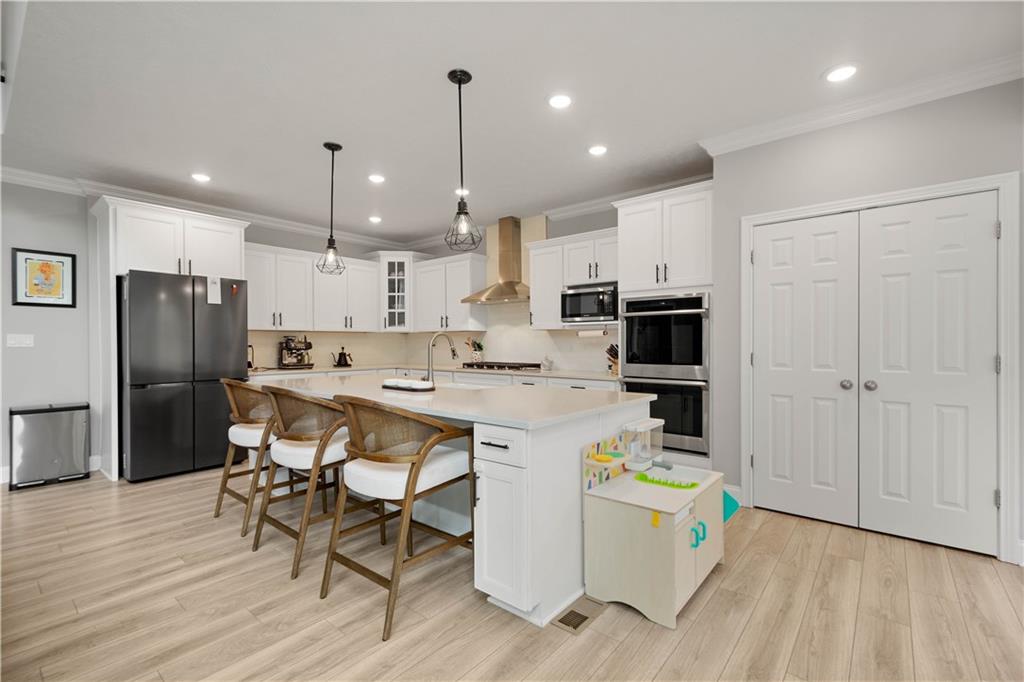 1197 Brook View Court Pittsburgh, PA 15237 - Photo 3 of 30 a kitchen with a sink a center island stainless steel appliances and cabinets