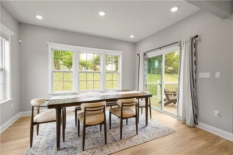 a view of a dining room with furniture window and outside view