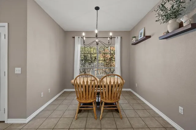 a view of a dining room with furniture window and outside view