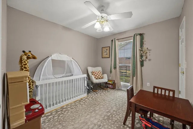 a living room with furniture a table and a window