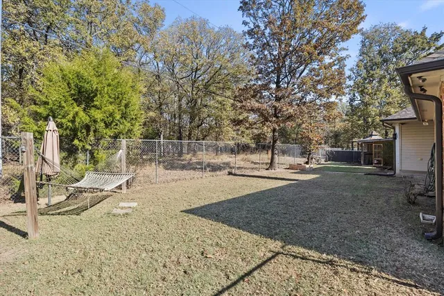 a view of yard with swimming pool