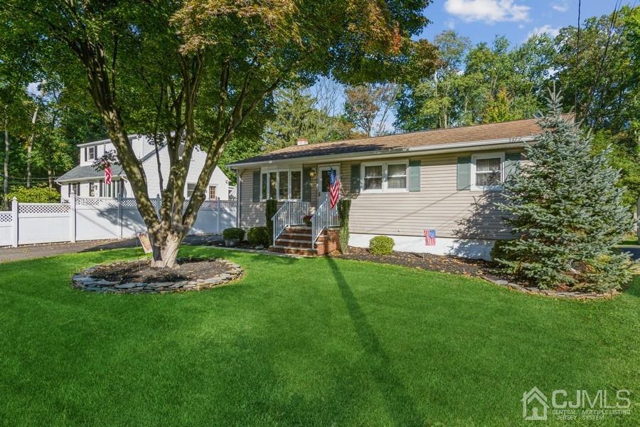 12 New Street Middlesex, NJ 08846 - Photo 2 of 20 a front view of house with yard and green space