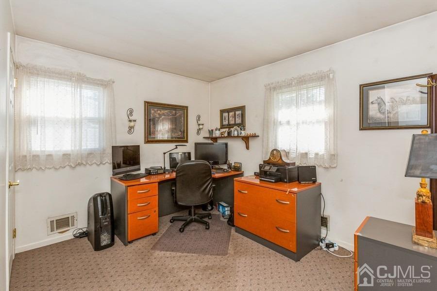 12 New Street Middlesex, NJ 08846 - Photo 12 of 20 a view of a workspace with furniture and a window