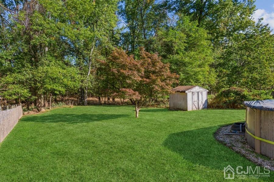 12 New Street Middlesex, NJ 08846 - Photo 19 of 20 a house with green field in front of it