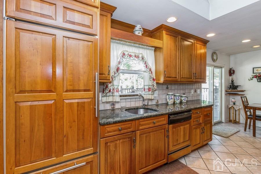 12 New Street Middlesex, NJ 08846 - Photo 7 of 20 a kitchen with stainless steel appliances granite countertop cabinets and window