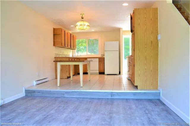 a view of a living room with a wooden floor