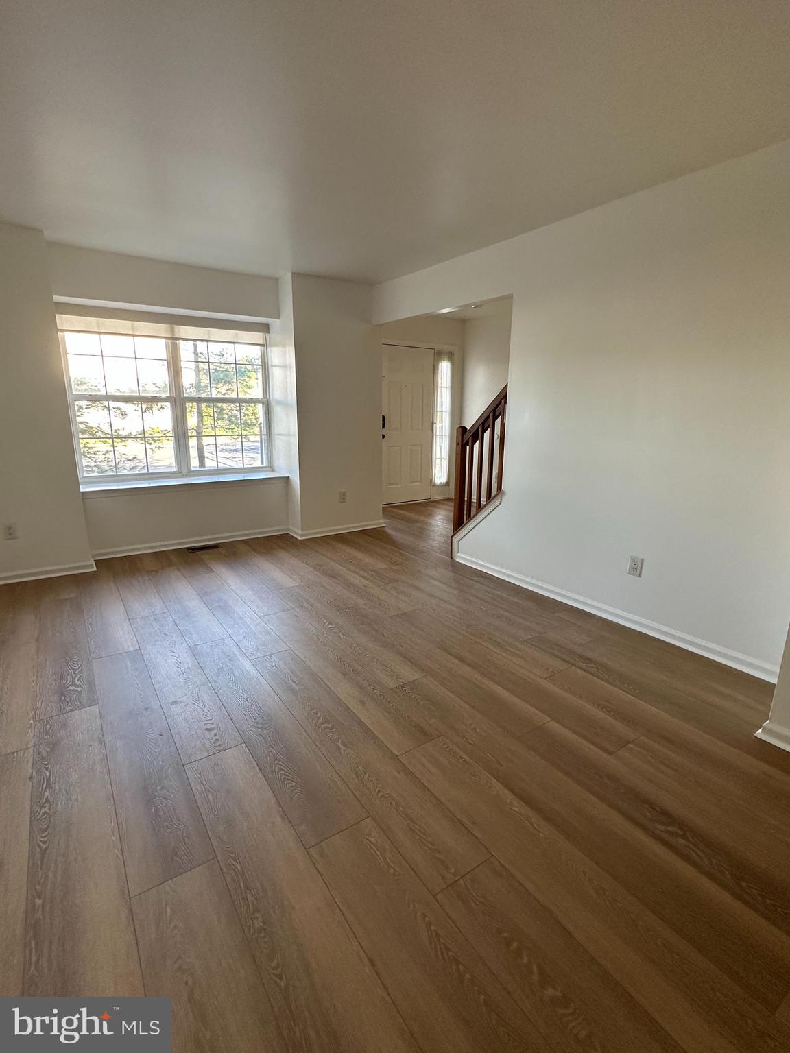 101 Coventry Way Mount Laurel, NJ 08054 - Photo 4 of 31 an empty room with wooden floor and windows