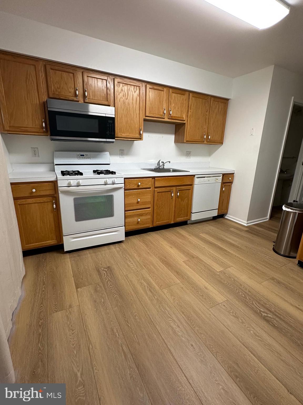 101 Coventry Way Mount Laurel, NJ 08054 - Photo 6 of 31 a kitchen with stainless steel appliances a stove a sink and a microwave