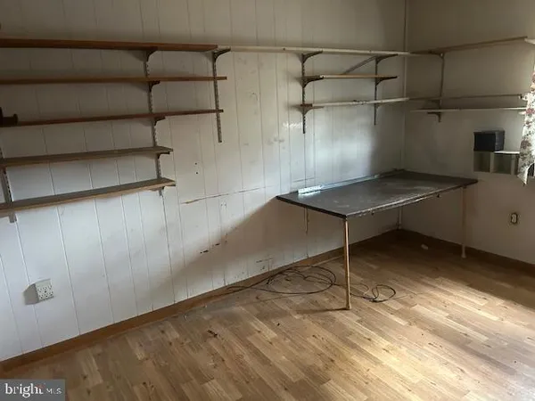 a view of a room with racks on the wall