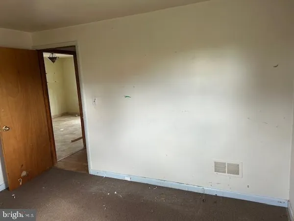 an empty room with an entrance door