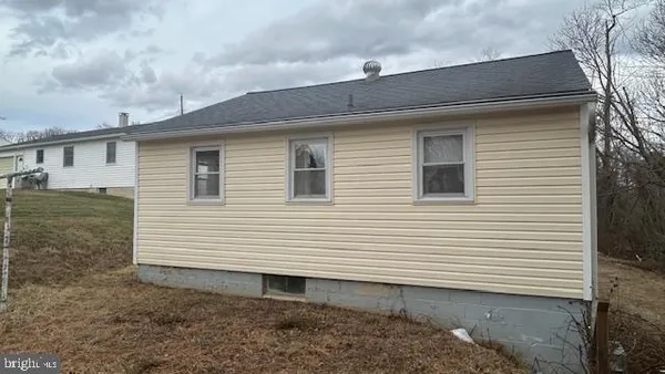 a view of a house with a yard and garage