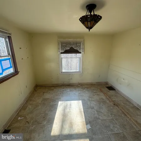 a view of entryway and hall with a window