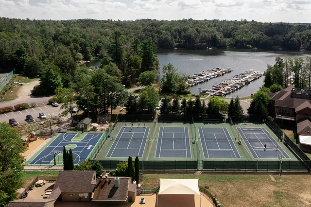 an aerial view of a house with a lake view