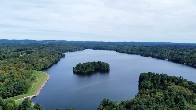 an aerial view of a house with mountain view