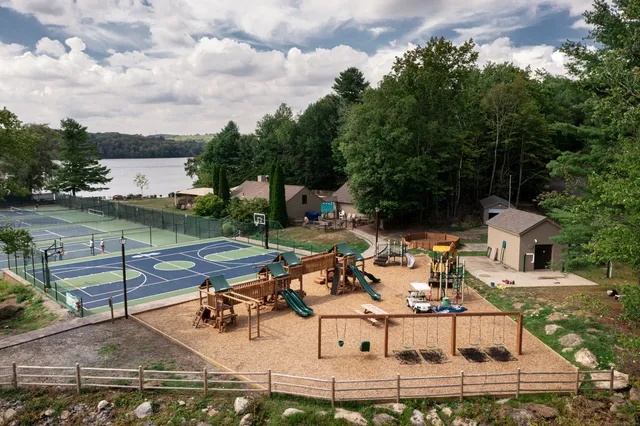 an aerial view of a house with outdoor space