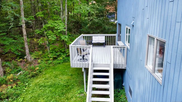 a view of front door and small yard