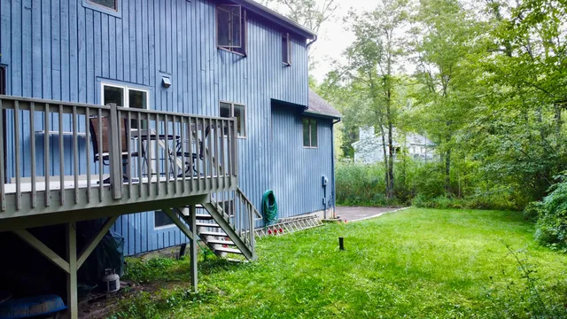 a view of a wooden deck front of house
