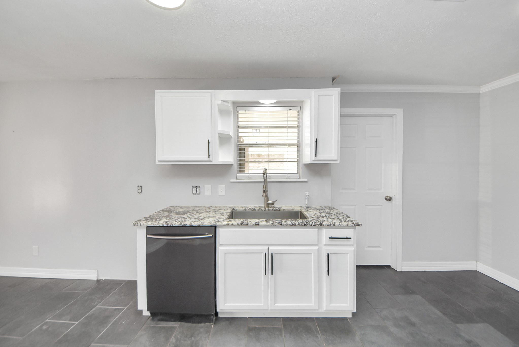 2004 Manor Street Dayton, TX 77535 - Photo 9 of 21 kitchen, fridge goes to the left of the dishwasher