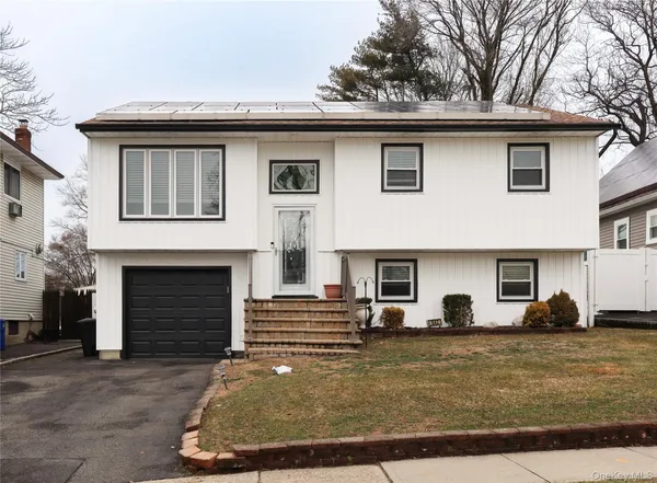 a view of a car park in front of house