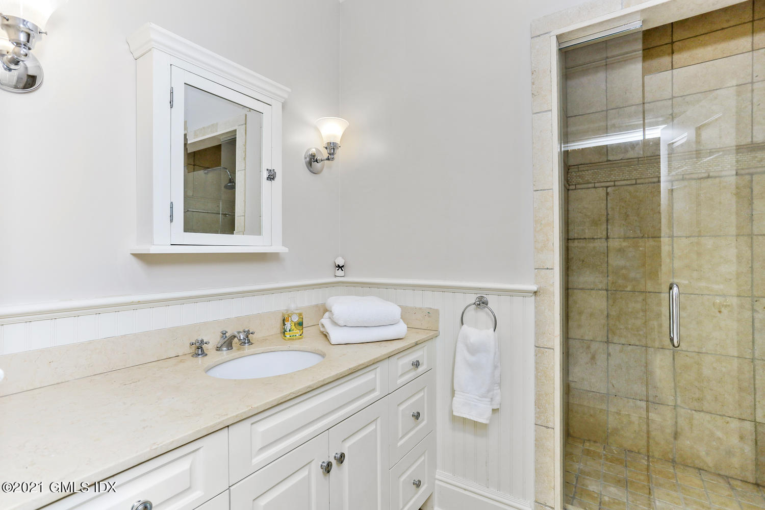 15 Shoal Point Lane Riverside, CT 06878 - Photo 23 of 37 a bathroom with a granite countertop sink and a shower
