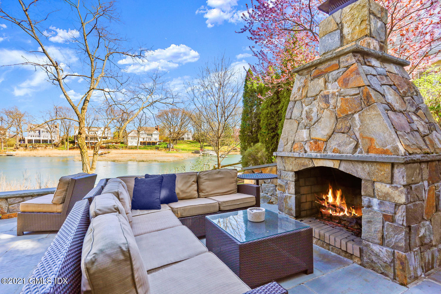15 Shoal Point Lane Riverside, CT 06878 - Photo 33 of 37 a view of a patio with couches and a fireplace