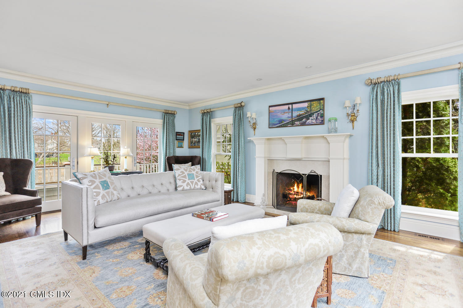 15 Shoal Point Lane Riverside, CT 06878 - Photo 5 of 37 a living room with furniture a fireplace and a large window