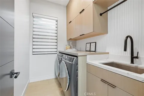a kitchen with a refrigerator and a sink
