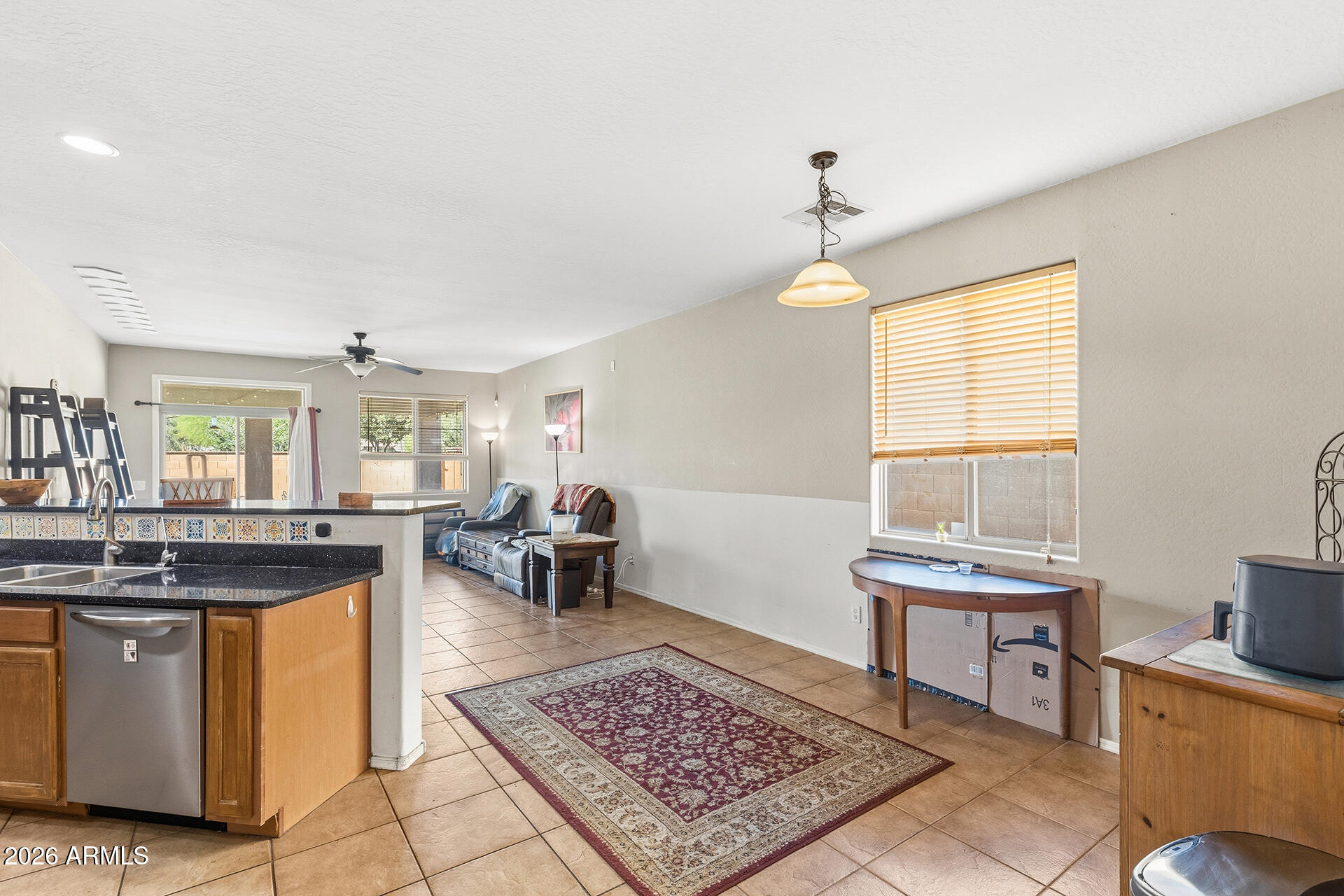 6718 West Darrel Road Laveen, AZ 85339 - Photo 2 of 49 a kitchen with a stove a sink and a dining table