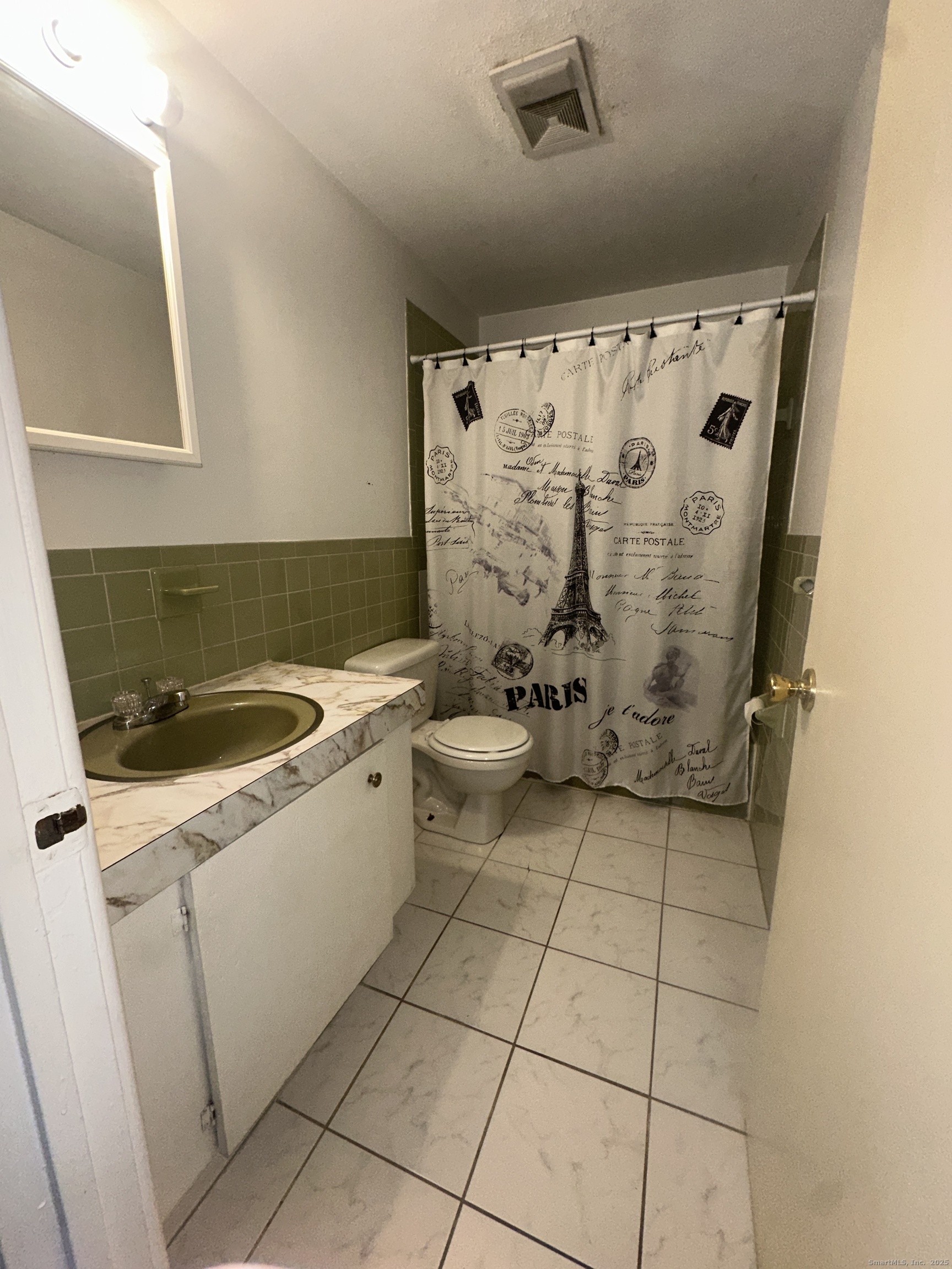 18 Canterbury Arms, Unit 18 New Milford, CT 06776 - Photo 2 of 6 a bathroom with a sink a toilet and shower