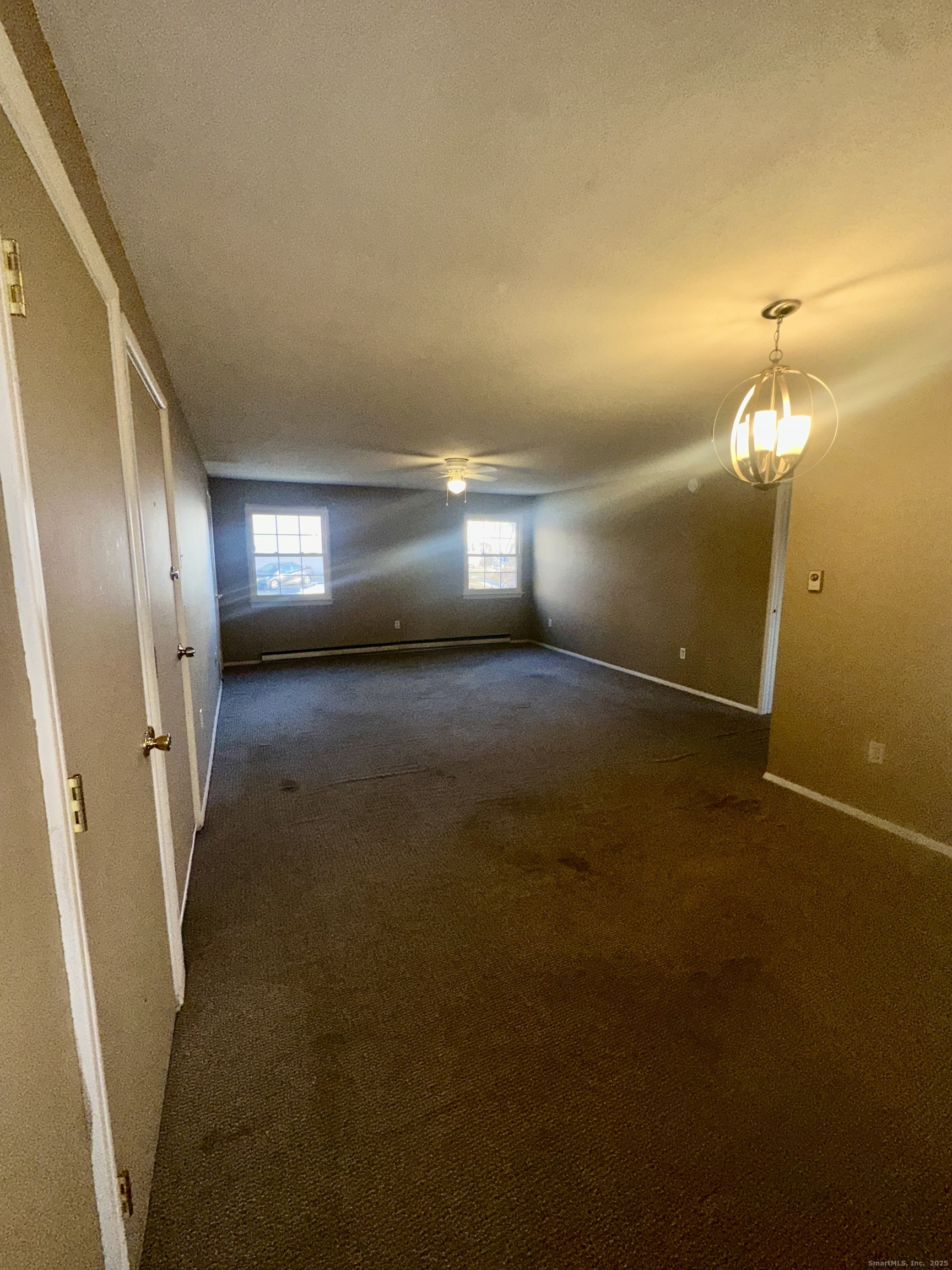 18 Canterbury Arms, Unit 18 New Milford, CT 06776 - Photo 3 of 6 a view of a hallway with stairs