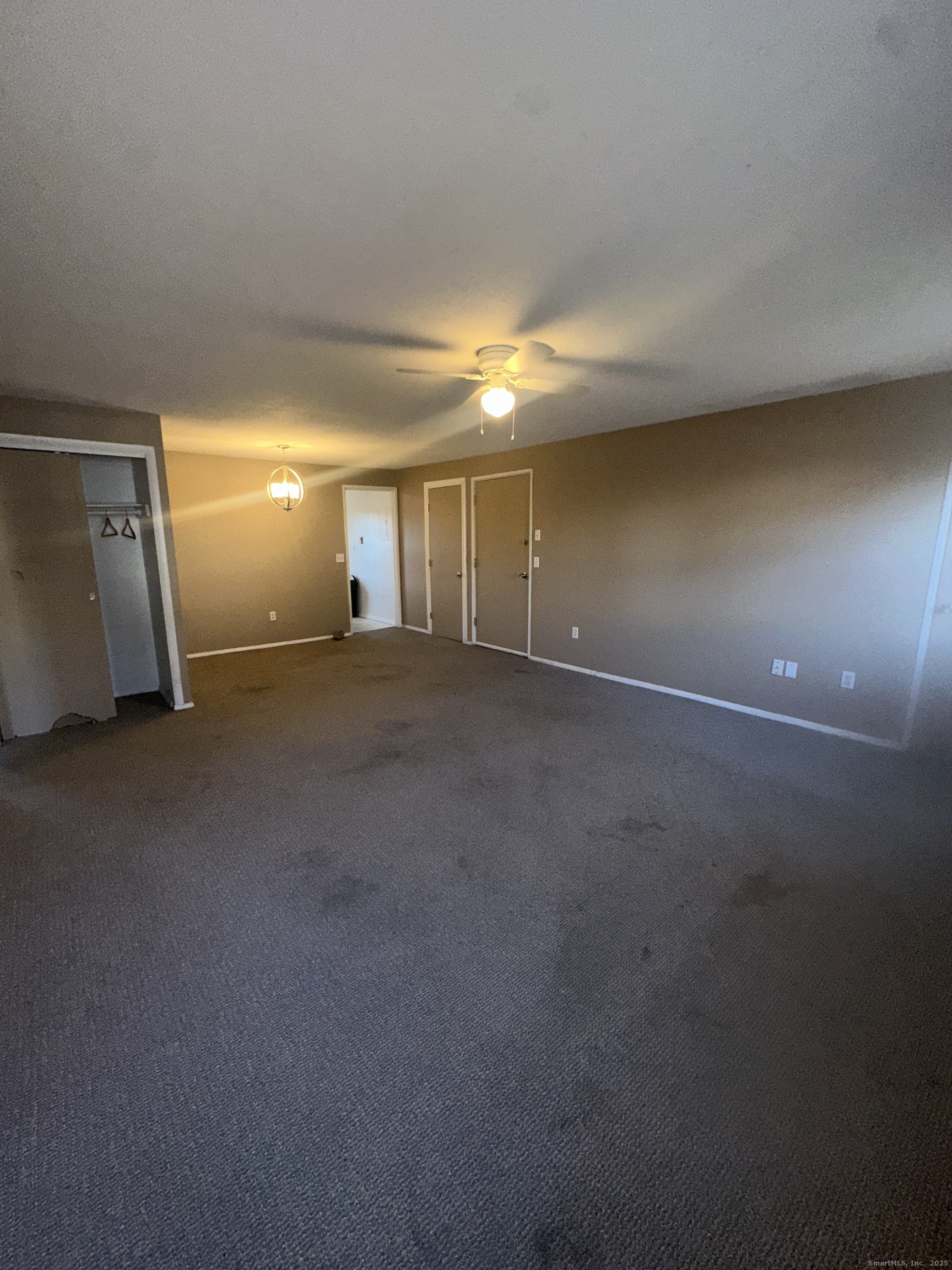 18 Canterbury Arms, Unit 18 New Milford, CT 06776 - Photo 4 of 6 a view of empty room