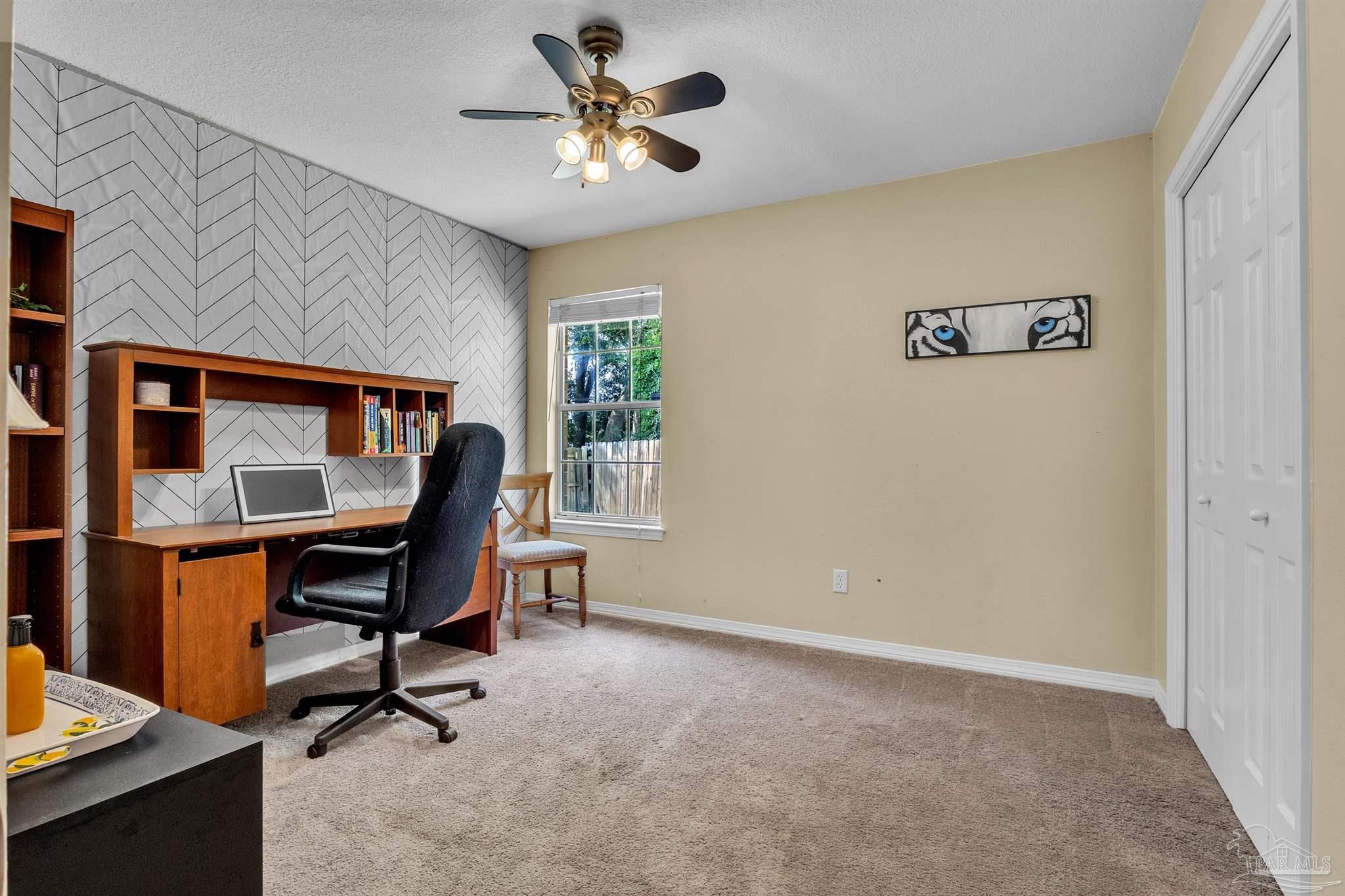 4321 Ridgeland Drive Pace, FL 32571 - Photo 22 of 36 a view of a workspace with furniture