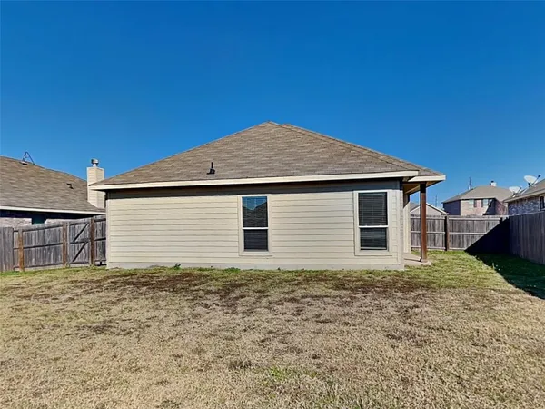 a house with yard in front of it