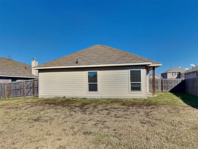 a house with yard in front of it
