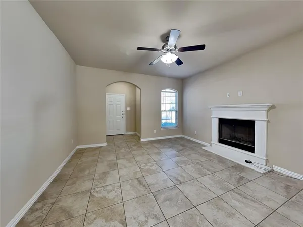 a view of empty room with fan