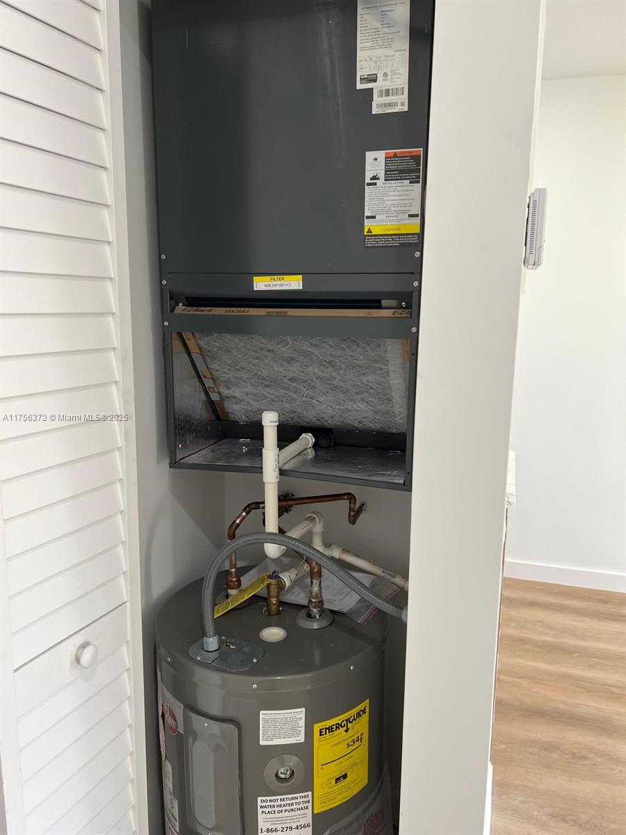 4227 Northwest 5th Street, Unit 8 Miami, FL 33126 - Photo 2 of 12 a view of water heater room